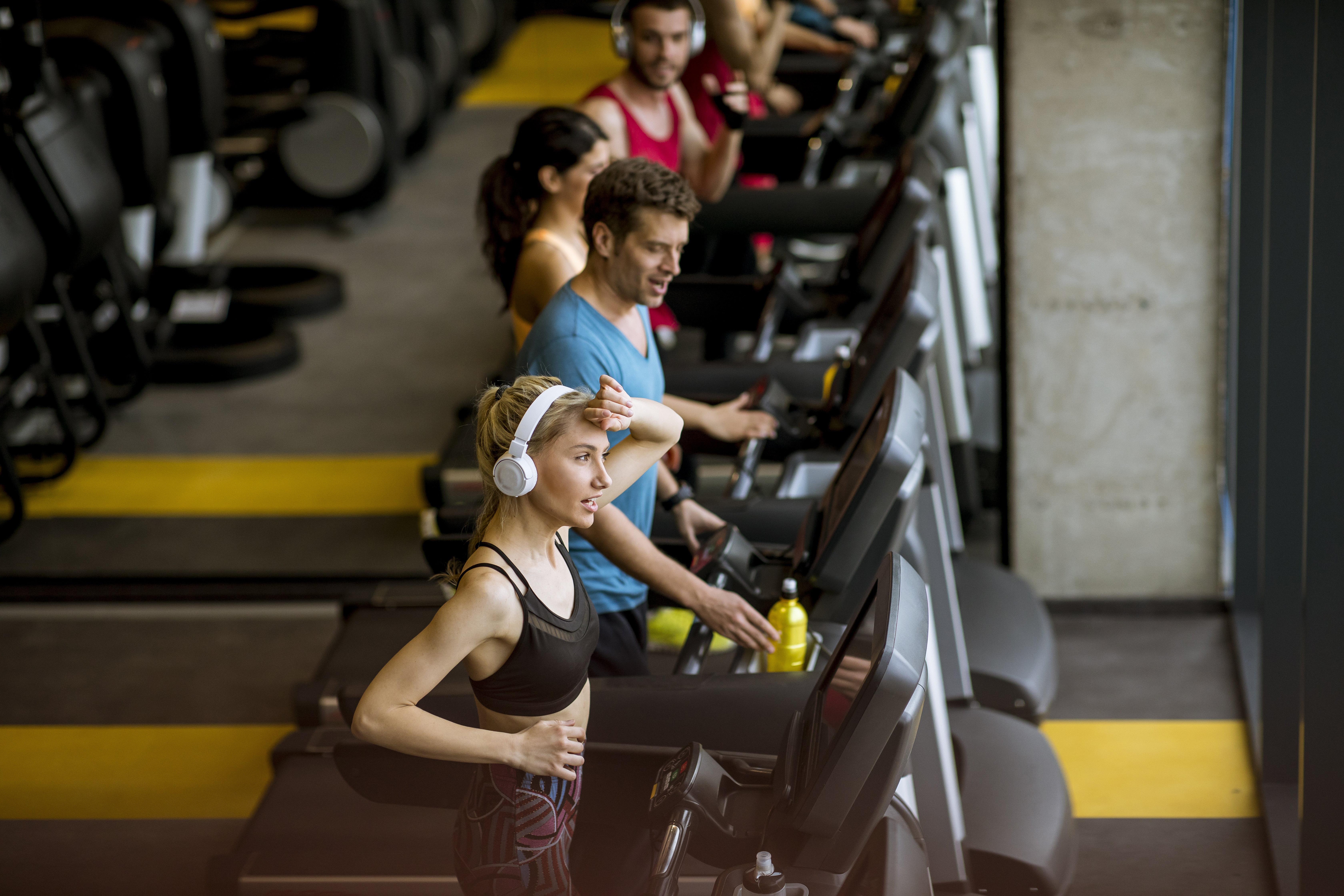 top-view-at-young-people-running-on-treadmills-in-2023-11-27-04-53-23-utc.jpg